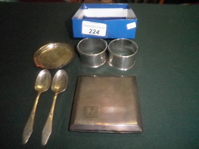 A mixed lot of small silver, including a pair of serviette rings, two pin dishes, two teaspoons