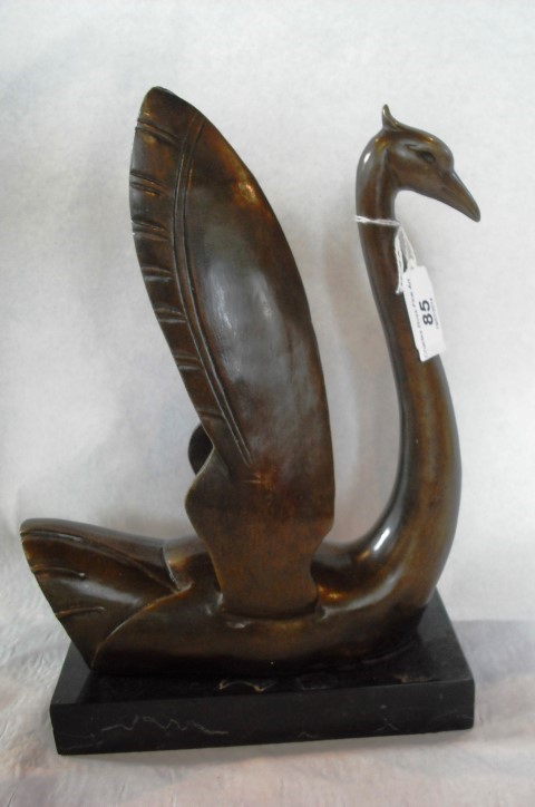 After Edouard Manet, a cast bronze figure of a swan-like bird with raised wings on rectangular