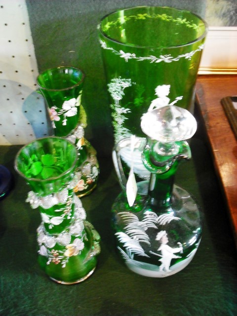 A collection of green Mary Gregory-type glass, to include a large cylindrical vase 25cm, a pair of