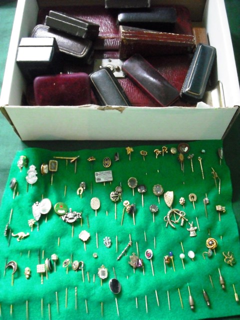 A collection of several dozen Victorian and later tie and lapel pins.  Various, including gold,