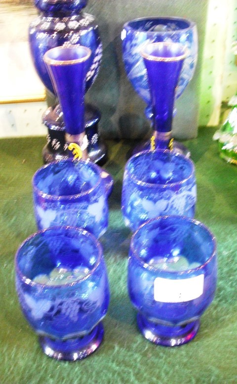 A collection of assorted blue Bohemian glassware, to include a large goblet, pair of vases, single