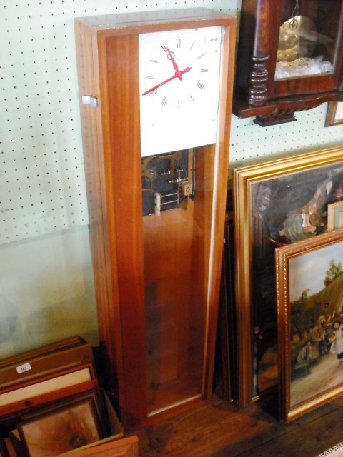 A 20th century teak cased wall clock by Hope Jones.