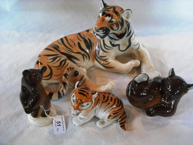 A Russian ceramic tiger by Lomonosov, together with a tiger cub and two bears.