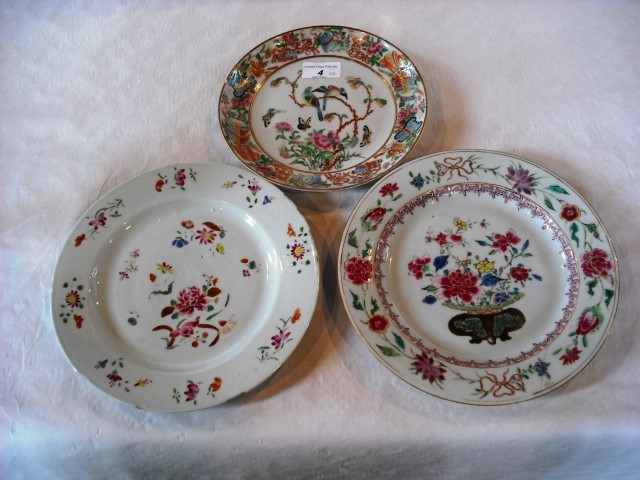 Two 18th century Chinese Famille Rose plates, both 23.5cm, together with a 19th century Canton plate
