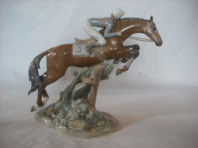 A Lladro porcelain figure, 'Jockey Mounted', number 5089, 34cm tall.