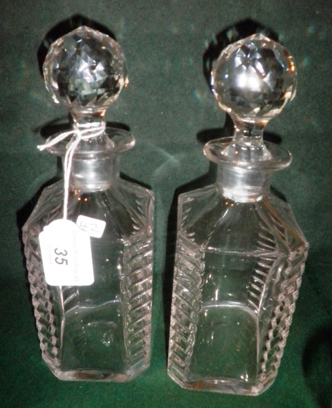 A pair of 19th century cut glass liqueur decanters, each with stopper.