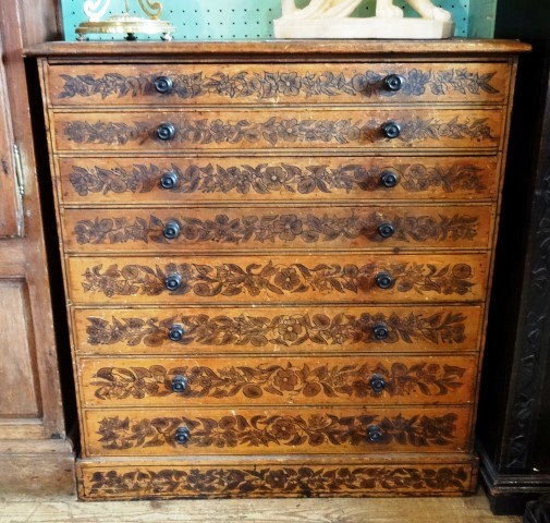 A 19th century pine artist's/folio chest, the rectangular top over eight drawers, each stencil