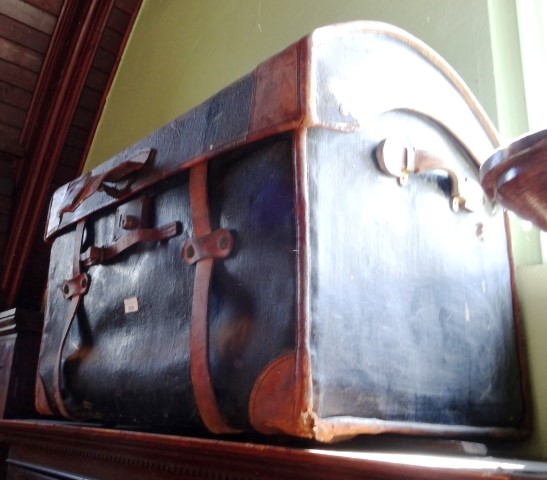 A 19th century leather cabin trunk of dome topped form, with original locks, handles and straps.