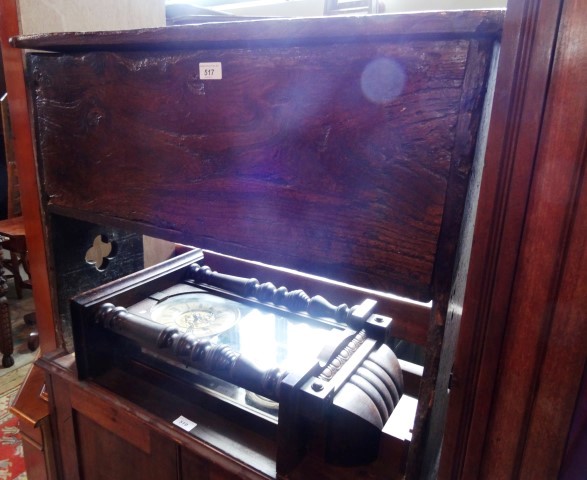 An early 18th century elm coffer of small proportions, the wire hinged top opening to reveal a