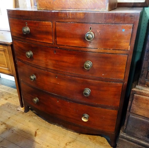 A Regency mahogany chest of bow front form, having two short and three graduated long drawers,