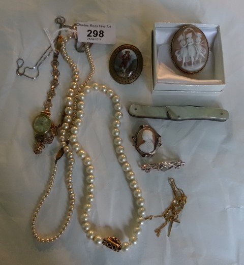 A small mixed lot of bijouterie, including two shell cameo brooches, a porcelain and enamel brooch