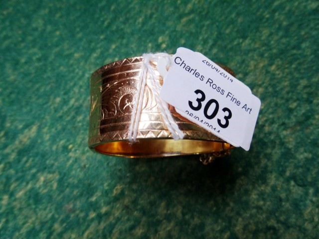 A Maltese gold (believed to be 18 carat) snap clasp bangle, bright cut decorated with stiff leaves