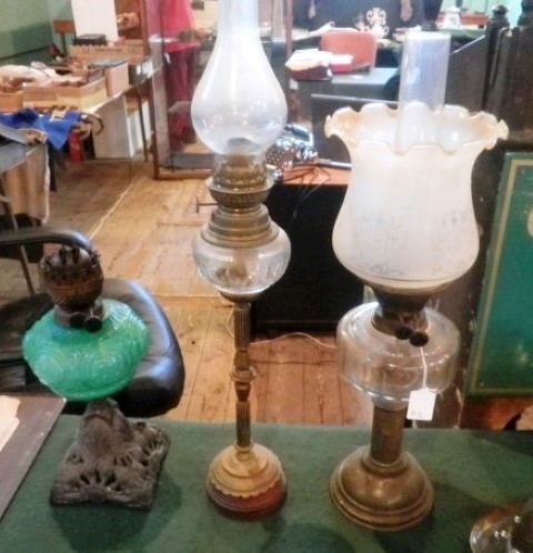 Three late Victorian paraffin lamps.