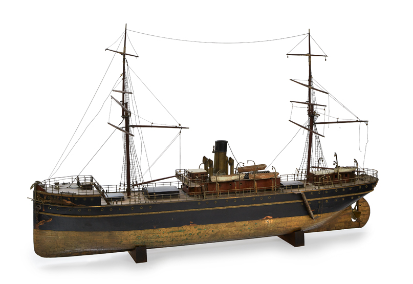 A LARGE LIVE-STEAM MODEL FOR A PASSENGER CARGO SHIP, CIRCA 1890, the hull carved and hollowed from