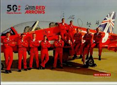 Red Arrows 2014 Team signed 12 x 8 colour photo. Stunning image of the ten team members in relaxed