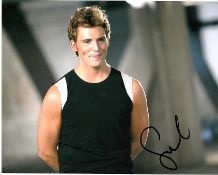 Sam Claflin 10x8 c photo of Sam from the Hunger Games, signed by him in London, 2014. Good condition