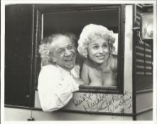 Barbara Windsor signed 10x8 b/w photo seen here in a Carry On film with Sid James. Dedicated but a