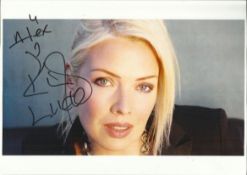 Kim Wilde Colour 8x12 photograph signed and dedicated by 80s pop star Kim Wilde. Good condition