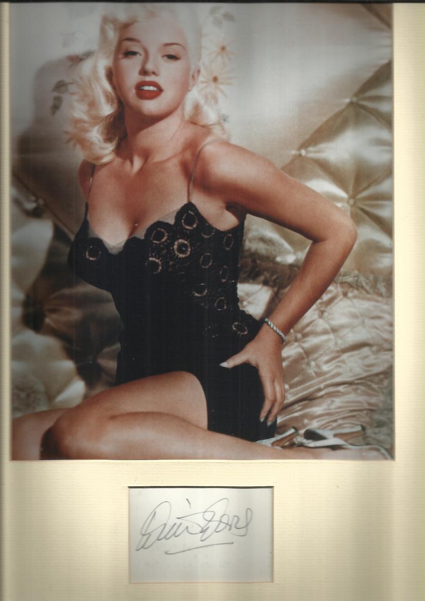 Diana Dors signature piece mounted with colour photo. Good condition