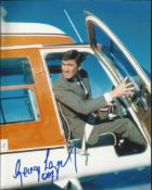George Lazenby, Stunning colour 8x10 photo autographed seen here as James Bond in the helicopter.