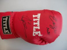 Joe & Enzo Calzaghe signed full size Title boxing glove. Good condition