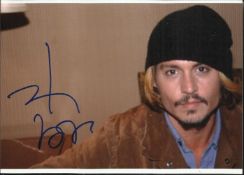Johnny Depp signed 7 x 5 colour photo, relaxed pose with woolly hat on. Good condition