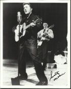 Scotty Moore signed 10 x 8 b/w photo playing with Elvis. Good condition