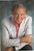 Val Doonican signed 6 x 4 colour photo to Brian lightly fixed to A4 white page.