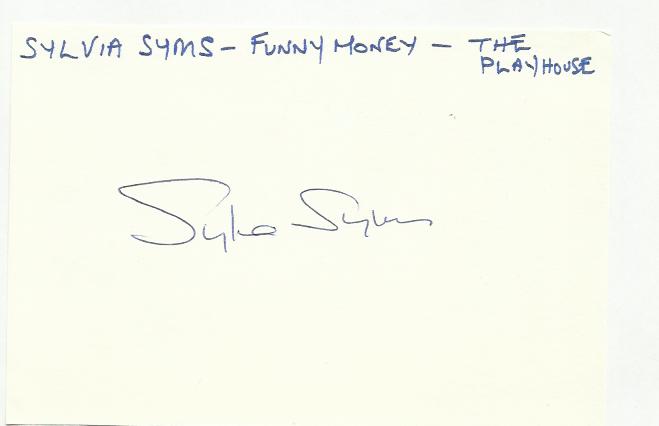 Sylvia Syms large autograph on white index card.