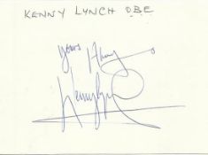 Kenny Lynch signed large 6 x 4 white card lightly fixed to A4 white page.