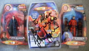 Dr Who signed action figures in original packaging. Character figures signed on outside plastic