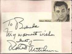 Robert Mitchum signature piece fixed to Autograph album page with small inset b/w photo.