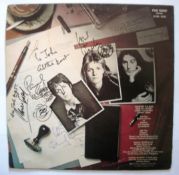 Paul & Linda McCartney signed Band on the run LP. Also signed by Denny Laine and on front by
