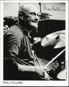 Phil Collins Black and white 8x10 photograph signed by the legendary Phil Collins, seen here at