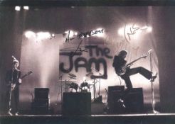 Bruce Foxton and Rick Buckler autographed The Jam photo. 42cm x 29cm black and white photograph of
