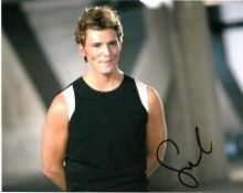 Sam Claflin 10x8 colour photo of Sam from The Hunger Games, signed by him in London. Good condition