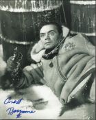 Ernest Borgnine signed 10 x 8 b/w photo from Ice Station Zebra lying in the snow with revolver. Good