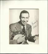 George Formby signed 1944 6 x 4 b/w photo classic image playing Banjo. Fitted in nice cream mount.