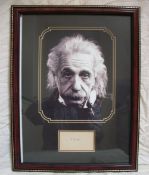 Albert Einstein signed piece framed and mounted with photo of the legendary scientist. Good
