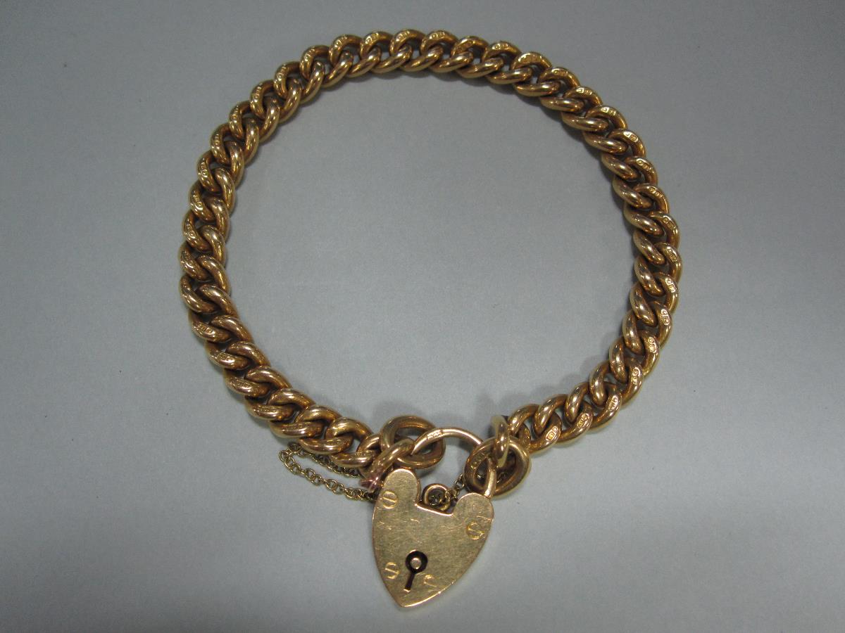 A Victorian 18ct gold chain and locket bracelet, every curb link assayed, Birmingham hallmark,