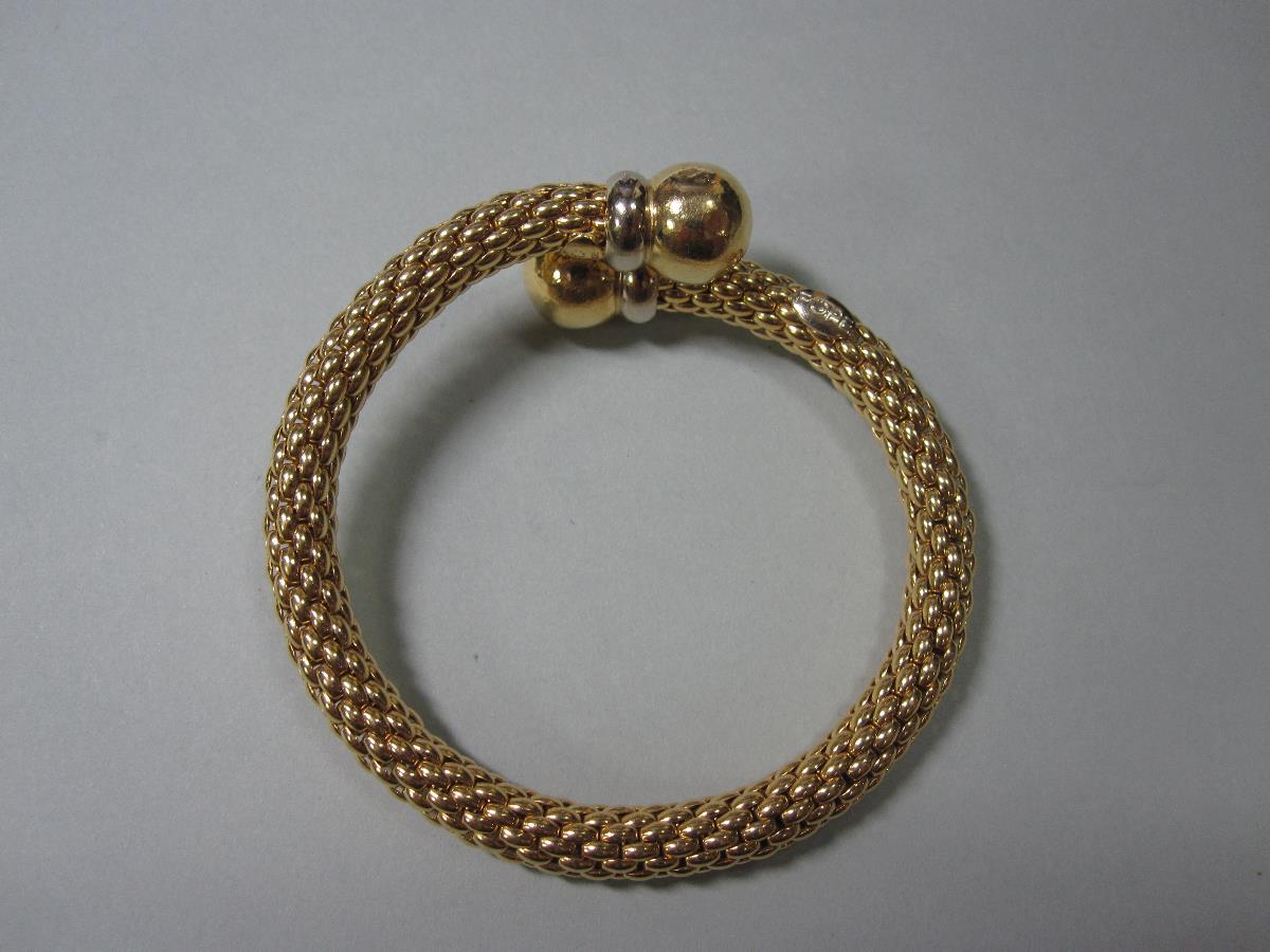 An Italian fexible torque bangle by Fope, designed as a tube of close set brick links of yellow - Image 4 of 4