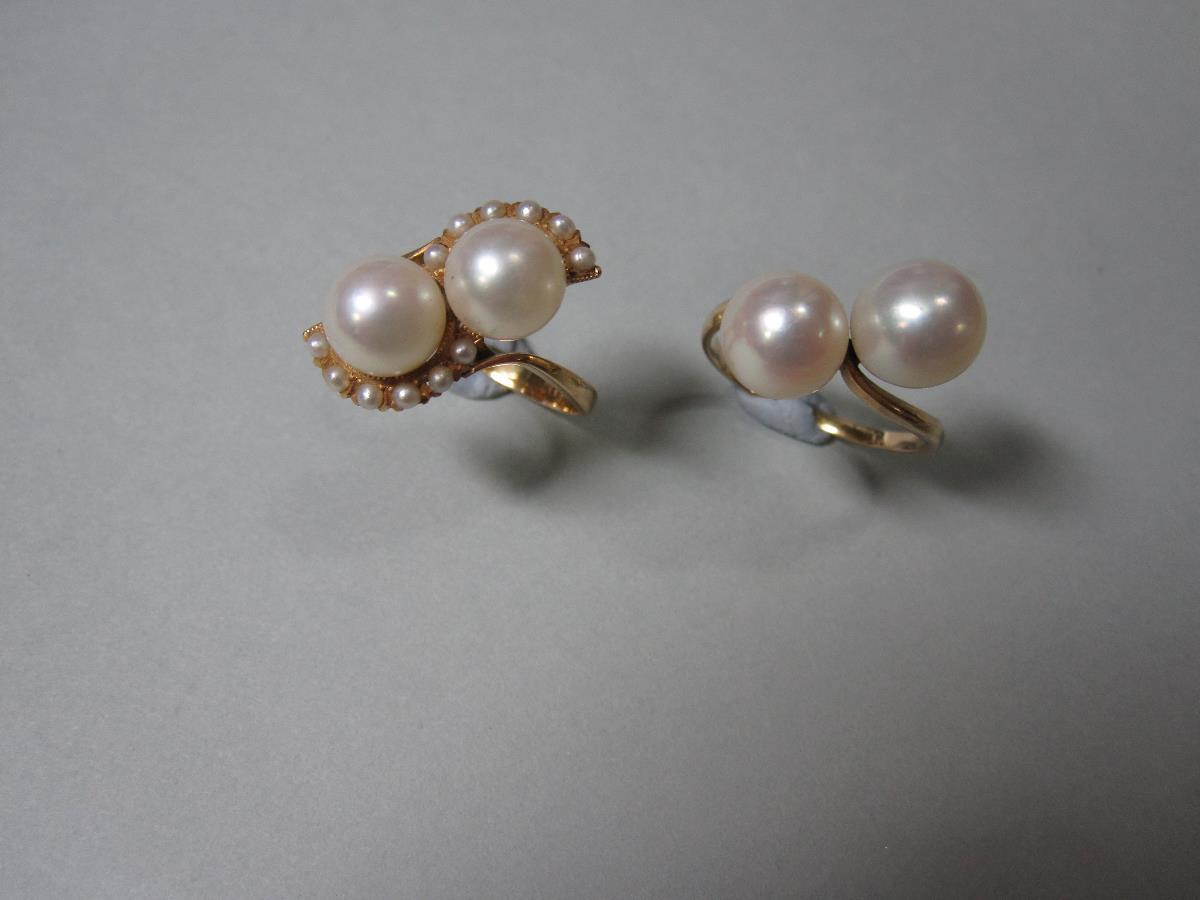 Two crossover pearl rings, the first a pearl and seed pearl ring with two 7.5mm pearls set in a