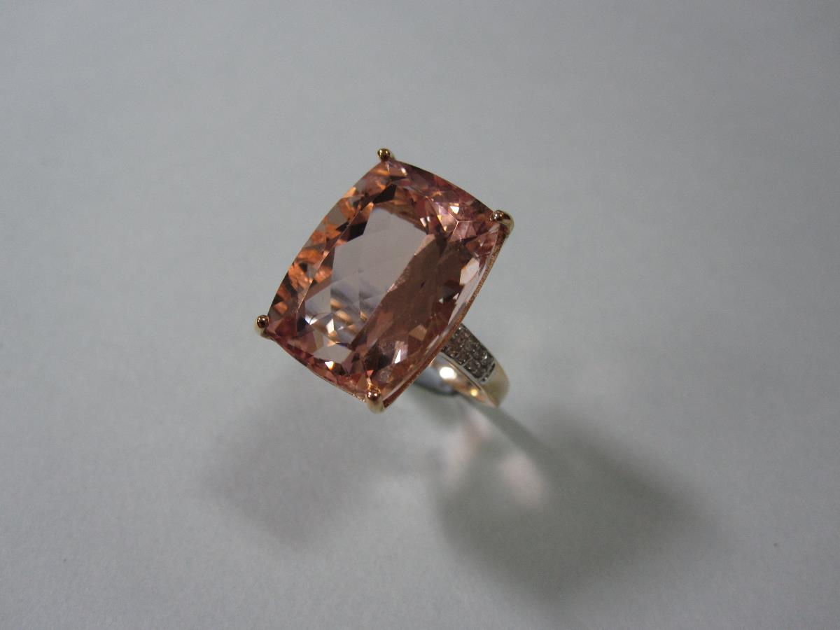 A morganite and diamond dress ring, the rectangular cushion shape harlequin cut morganite claw set