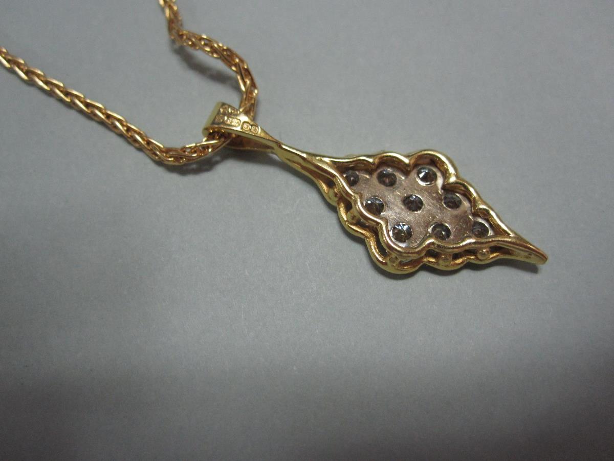 A modern diamond and 18ct gold pendant and chain, the pendant of scallop-edged diaper form set - Image 3 of 4