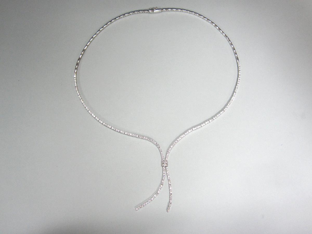 A contemporary diamond line negligée necklace, set in white precious metal stamped `750` for 18ct