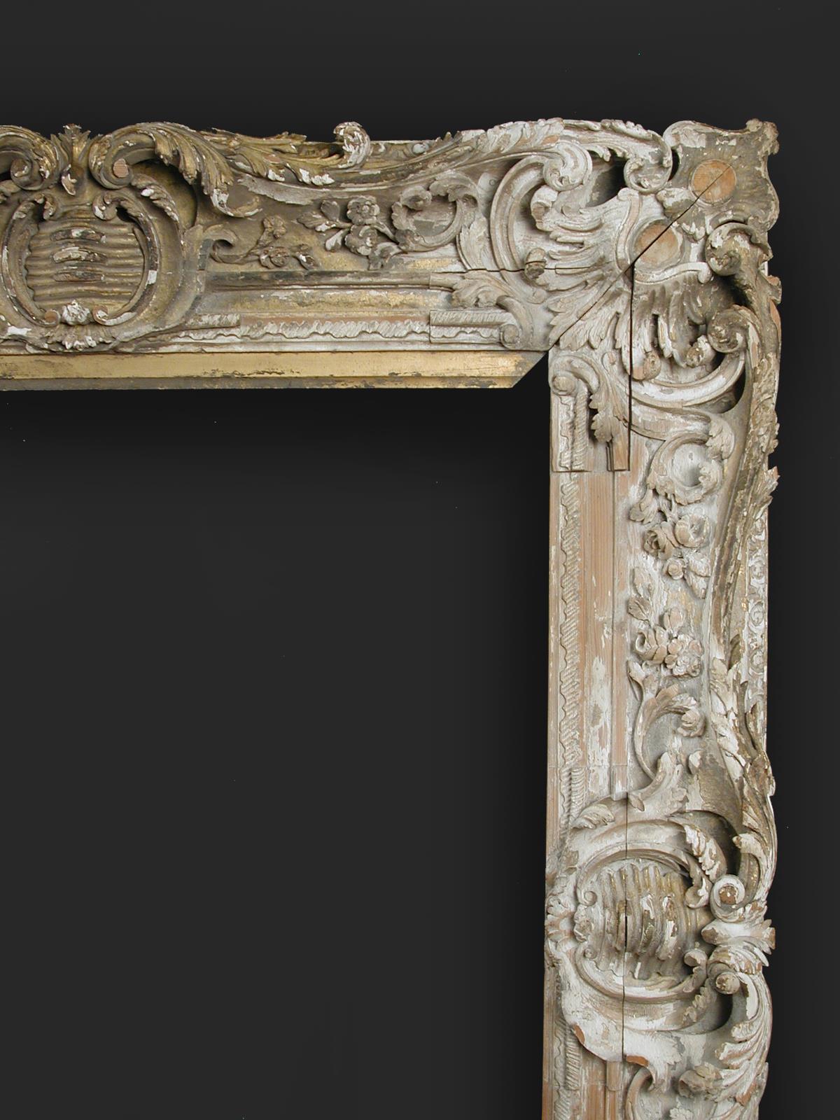 A carved late 18th/early 19th Century swept frame, previously gilded, sight size 84 x 102cm,