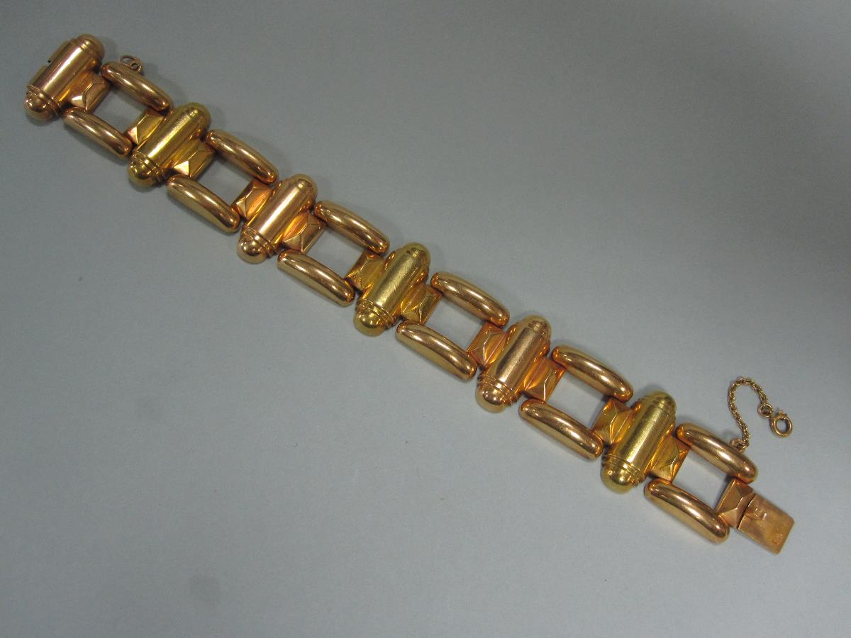 A 19ct gold chunky link bracelet, of bold geometric design with alternating open square and half