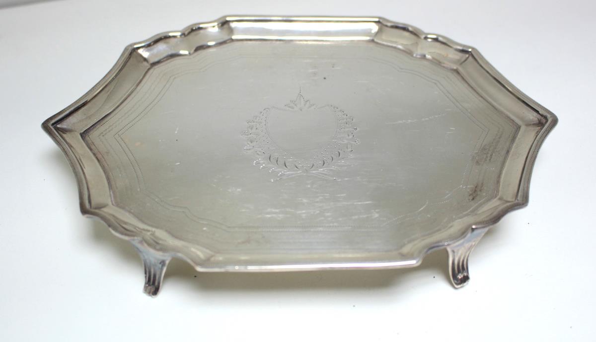 A George III silver teapot stand, by Solomon Hougham, London 1795, of shaped oval form within
