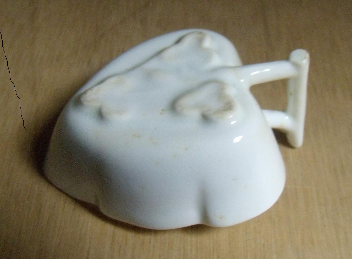 A Lowestoft white glazed butter boat, the stem handle to the leaf shape ending in three further - Image 2 of 2