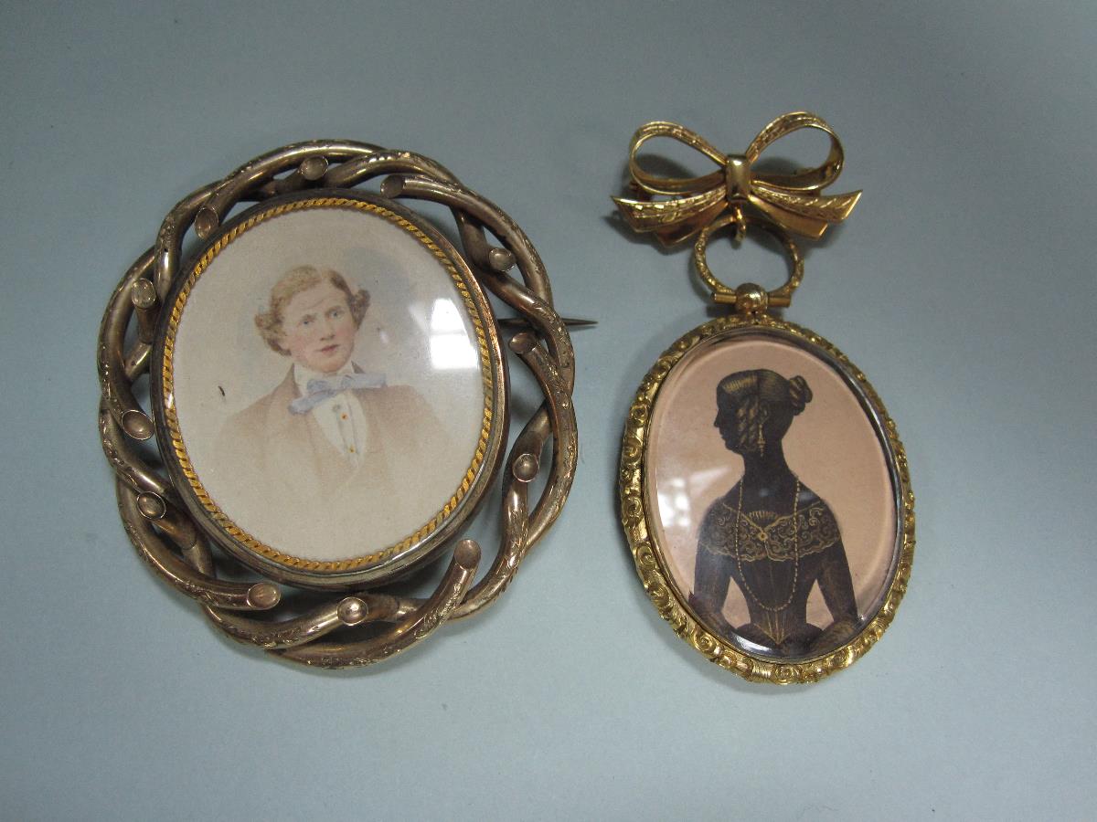 A double sided silhouette pendant circa 1840 together with a later Victorian miniature portrait and